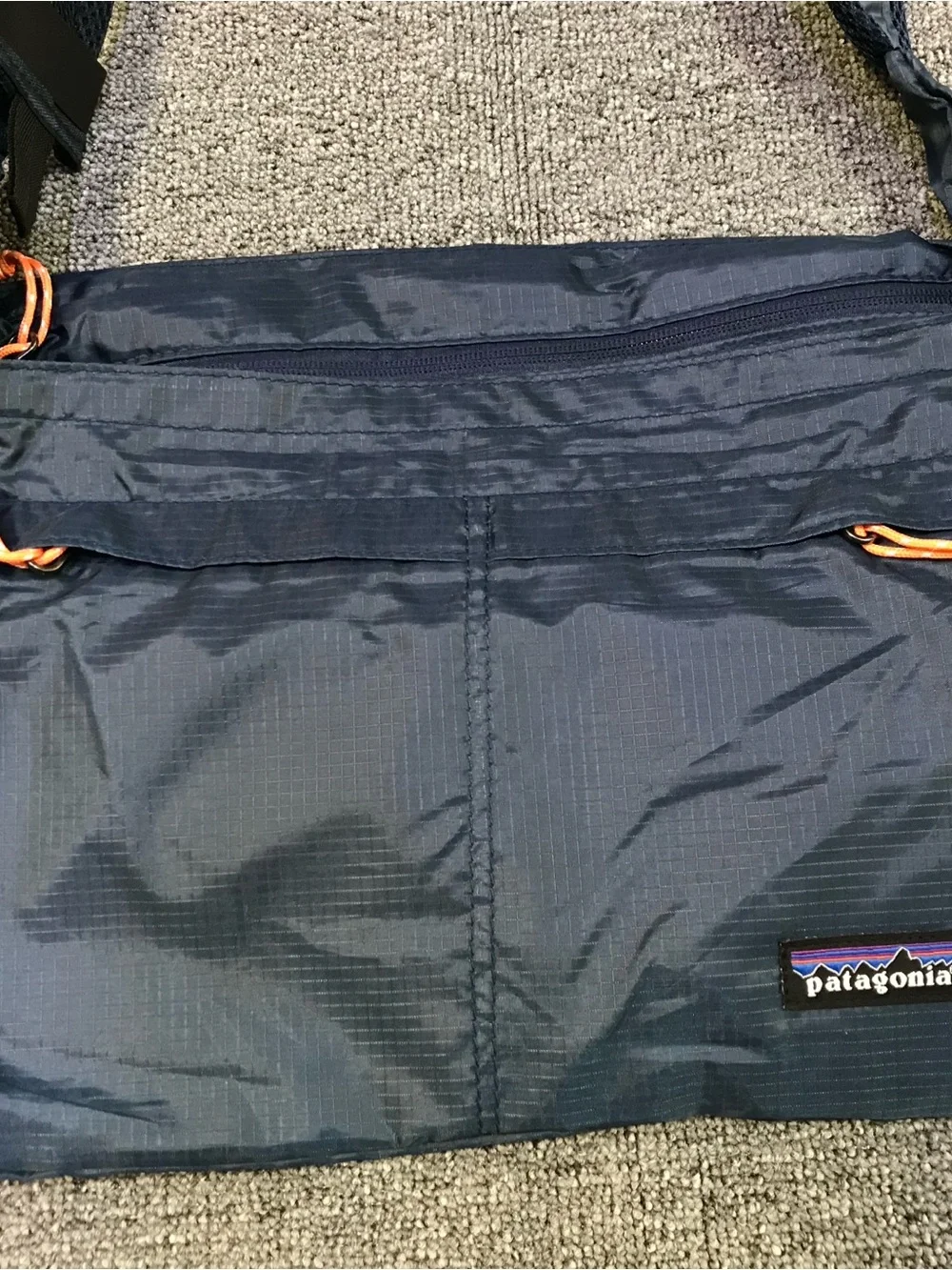 Patagonia Navy Blue Crossbody Travel Bag with Orange Accents